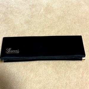 Gucci black satin formal evening clutch. Champagne gold logo.